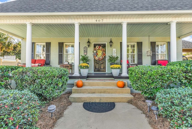 property entrance featuring covered porch