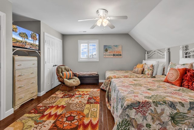 bedroom featuring ceiling fan, lofted ceiling, dark hardwood / wood-style floors, and a closet