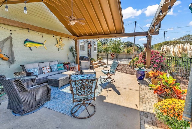 view of patio featuring an outdoor hangout area and ceiling fan