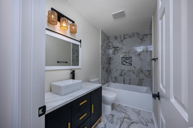 full bathroom with vanity, tiled shower / bath combo, and toilet