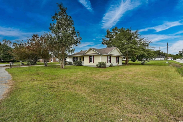 view of property exterior featuring a lawn