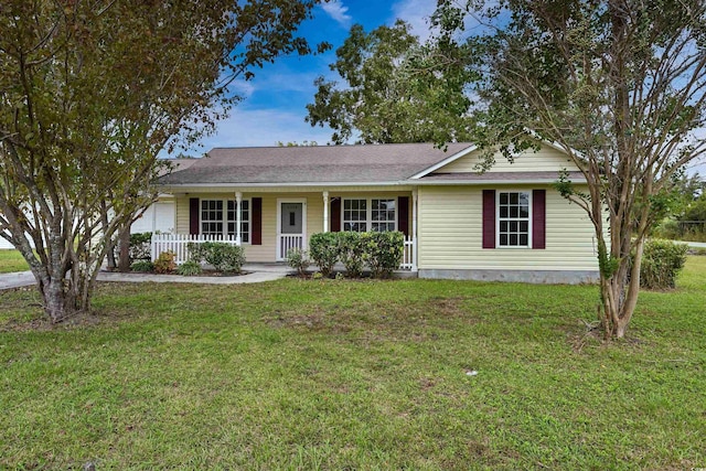 ranch-style home featuring a front yard and a porch