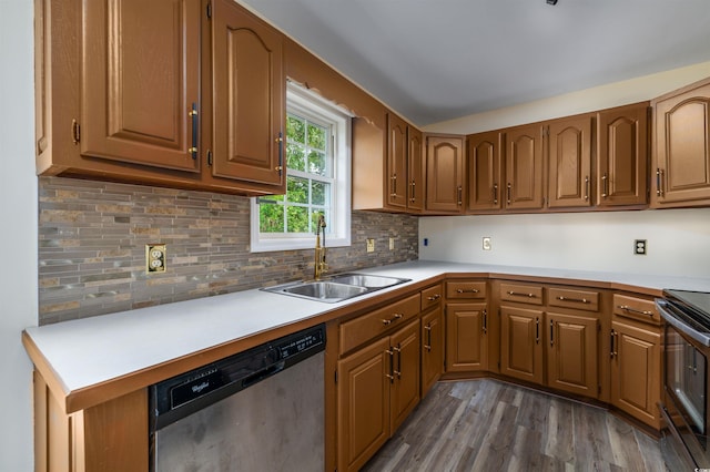 kitchen featuring tasteful backsplash, stainless steel dishwasher, sink, electric range, and dark hardwood / wood-style floors