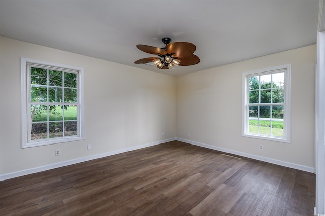 unfurnished room with ceiling fan and dark hardwood / wood-style floors