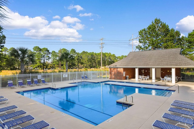 view of swimming pool featuring a patio area