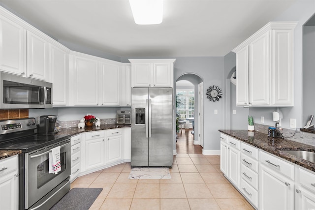 kitchen featuring white cabinetry and stainless steel appliances