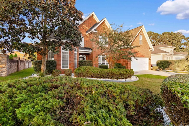 view of front of home featuring a garage and a front lawn