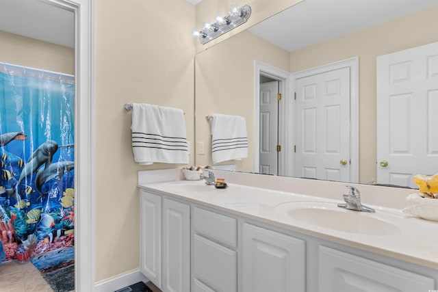 bathroom featuring tile patterned floors and vanity