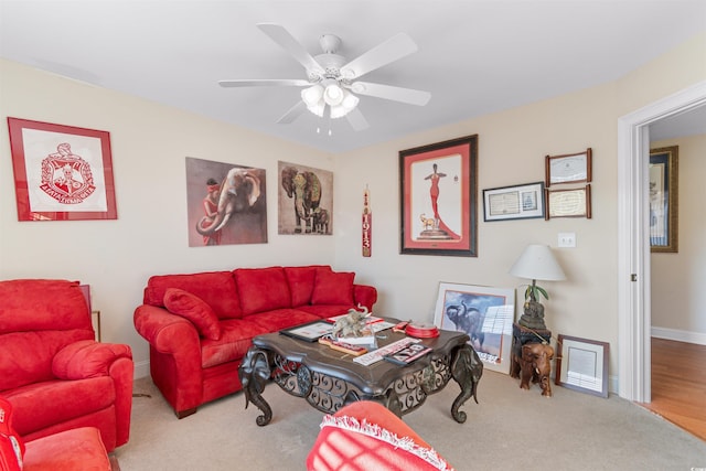 living room featuring hardwood / wood-style flooring and ceiling fan