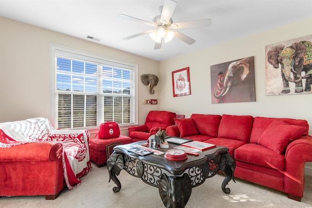 living room with ceiling fan and carpet flooring