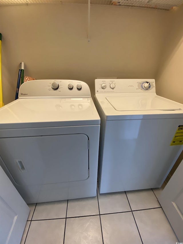 1538 Lanterns Rest Rd Unit 303, Myrtle Beach, SC 29579 - laundry area featuring separate washer and dryer and light tile patterned flooring
