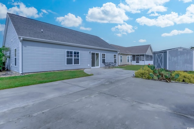 view of front facade with a patio and a front lawn