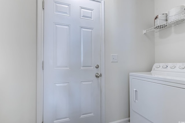 clothes washing area featuring washer / clothes dryer