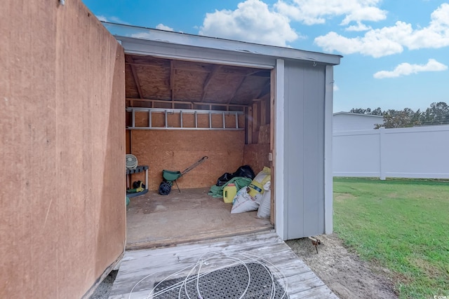 view of outdoor structure with a lawn