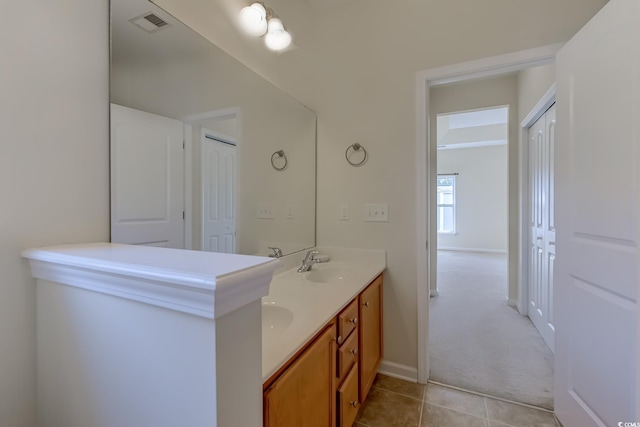 bathroom with tile patterned floors and vanity