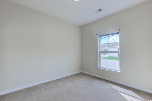 empty room with light colored carpet