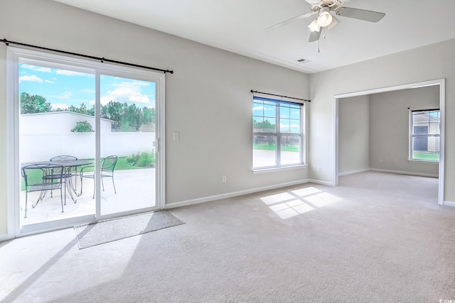 carpeted empty room with ceiling fan