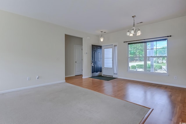 entryway featuring a notable chandelier and hardwood / wood-style floors