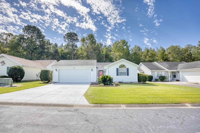 single story home featuring cooling unit, a front yard, and a garage