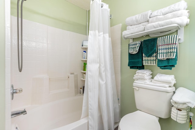 bathroom with shower / bath combo and toilet