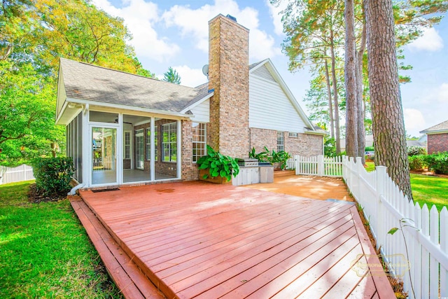 wooden deck with a lawn