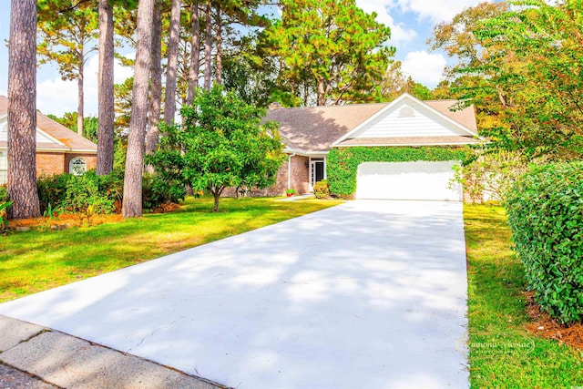 view of front of house with a garage and a front yard