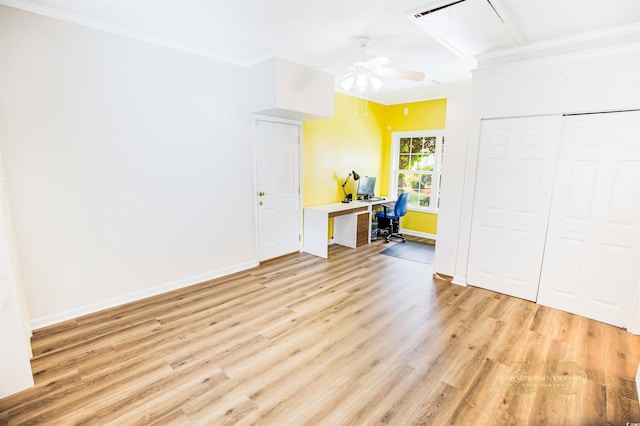 interior space with light wood-type flooring, ceiling fan, and ornamental molding