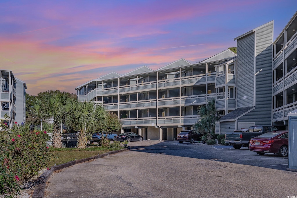 view of outdoor building at dusk