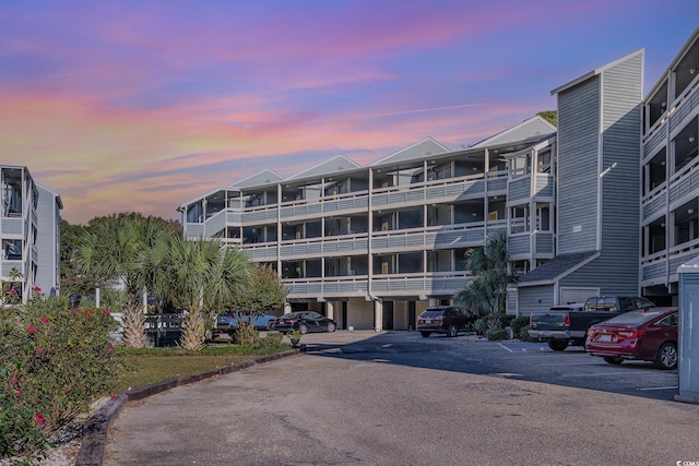 view of outdoor building at dusk