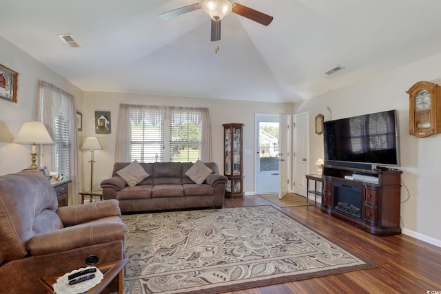 living room featuring ceiling fan, dark hardwood / wood-style flooring, and lofted ceiling