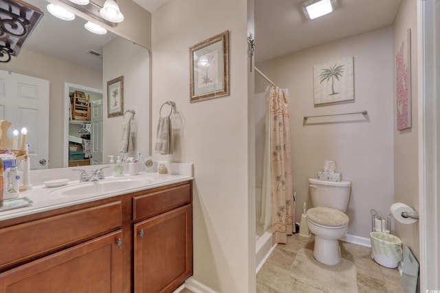 bathroom with tile patterned floors, vanity, a shower with shower curtain, and toilet