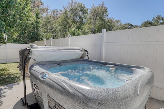 details with carpet floors, a hot tub, and wooden walls