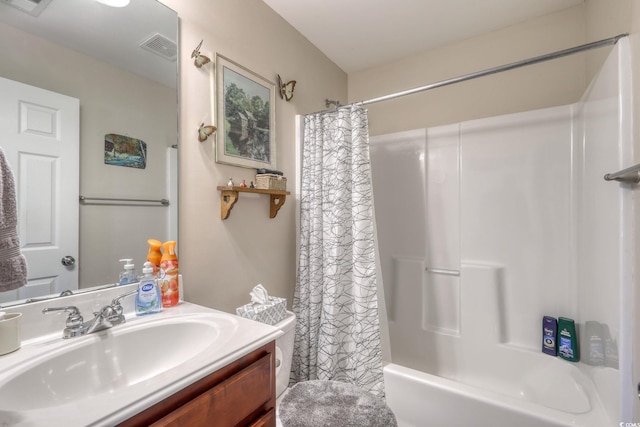 bathroom featuring vanity and shower / bathtub combination with curtain