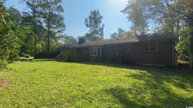 view of yard featuring a deck