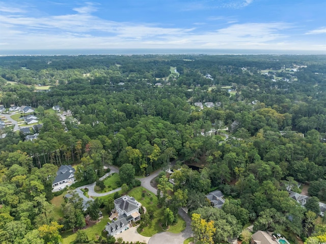 bird's eye view featuring a wooded view