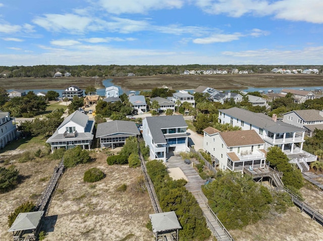 aerial view of residential area featuring a large body of water