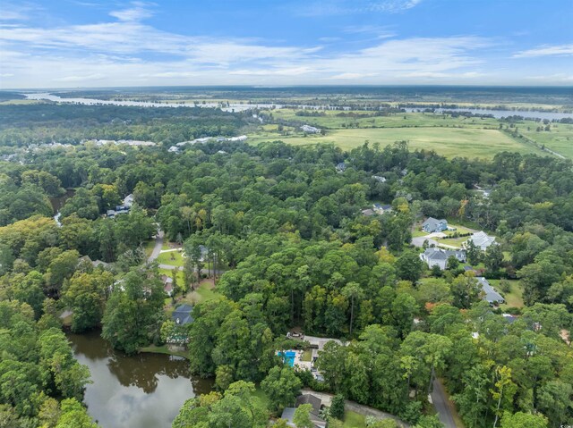 aerial view of property's location with a large body of water