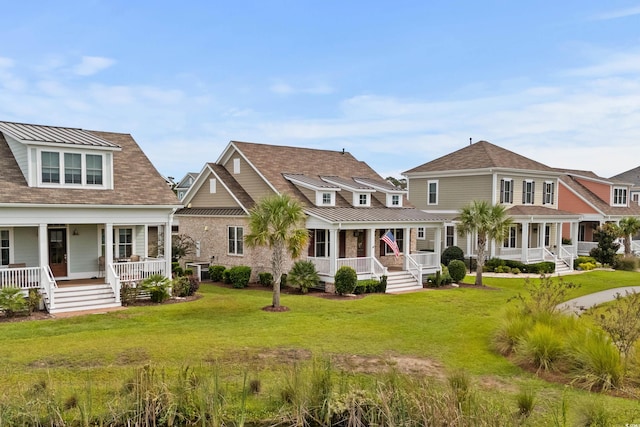 view of front of property with a front lawn and covered porch