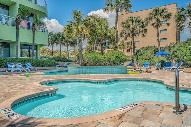 view of swimming pool featuring a patio area