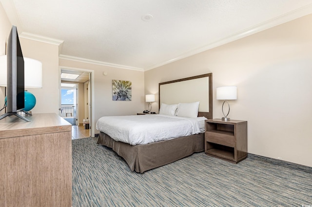 bedroom with ornamental molding and dark colored carpet