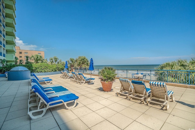 view of patio featuring a water view