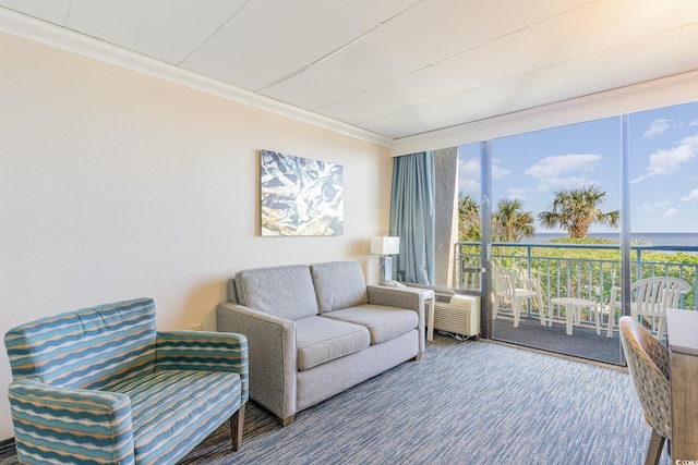 carpeted living room featuring floor to ceiling windows and crown molding