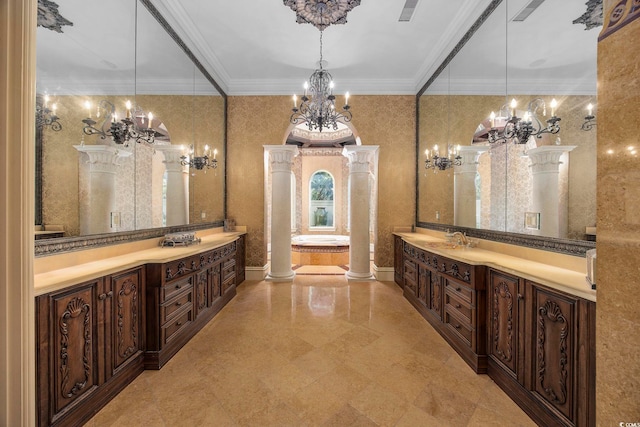 full bath featuring visible vents, a chandelier, ornamental molding, vanity, and ornate columns