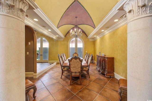 tiled dining area with lofted ceiling, recessed lighting, arched walkways, french doors, and crown molding