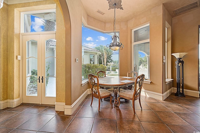 dining room featuring visible vents, french doors, and baseboards