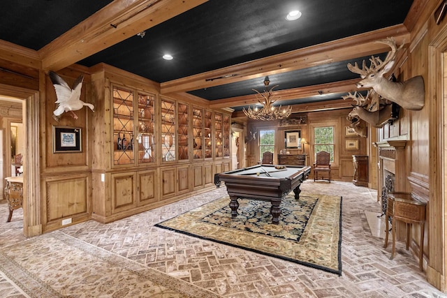 recreation room featuring beam ceiling, a notable chandelier, billiards, and wood walls