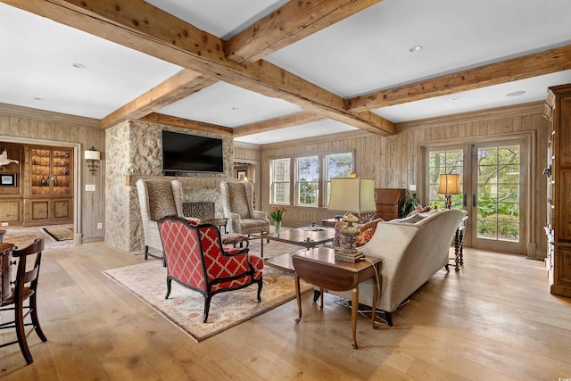 living room featuring wooden walls and plenty of natural light