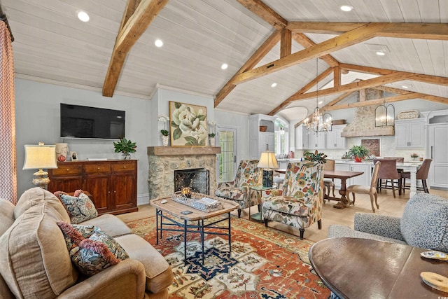 living room with vaulted ceiling with beams, wooden ceiling, a chandelier, and a high end fireplace