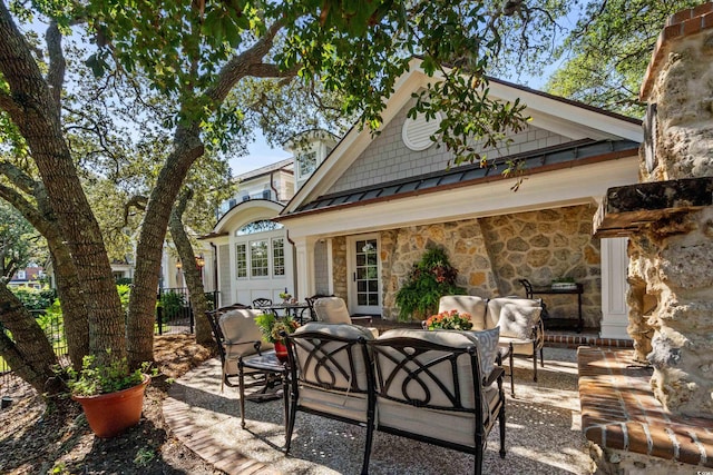 rear view of property featuring an outdoor hangout area and a patio