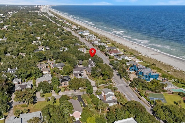 aerial view with a water view and a beach view